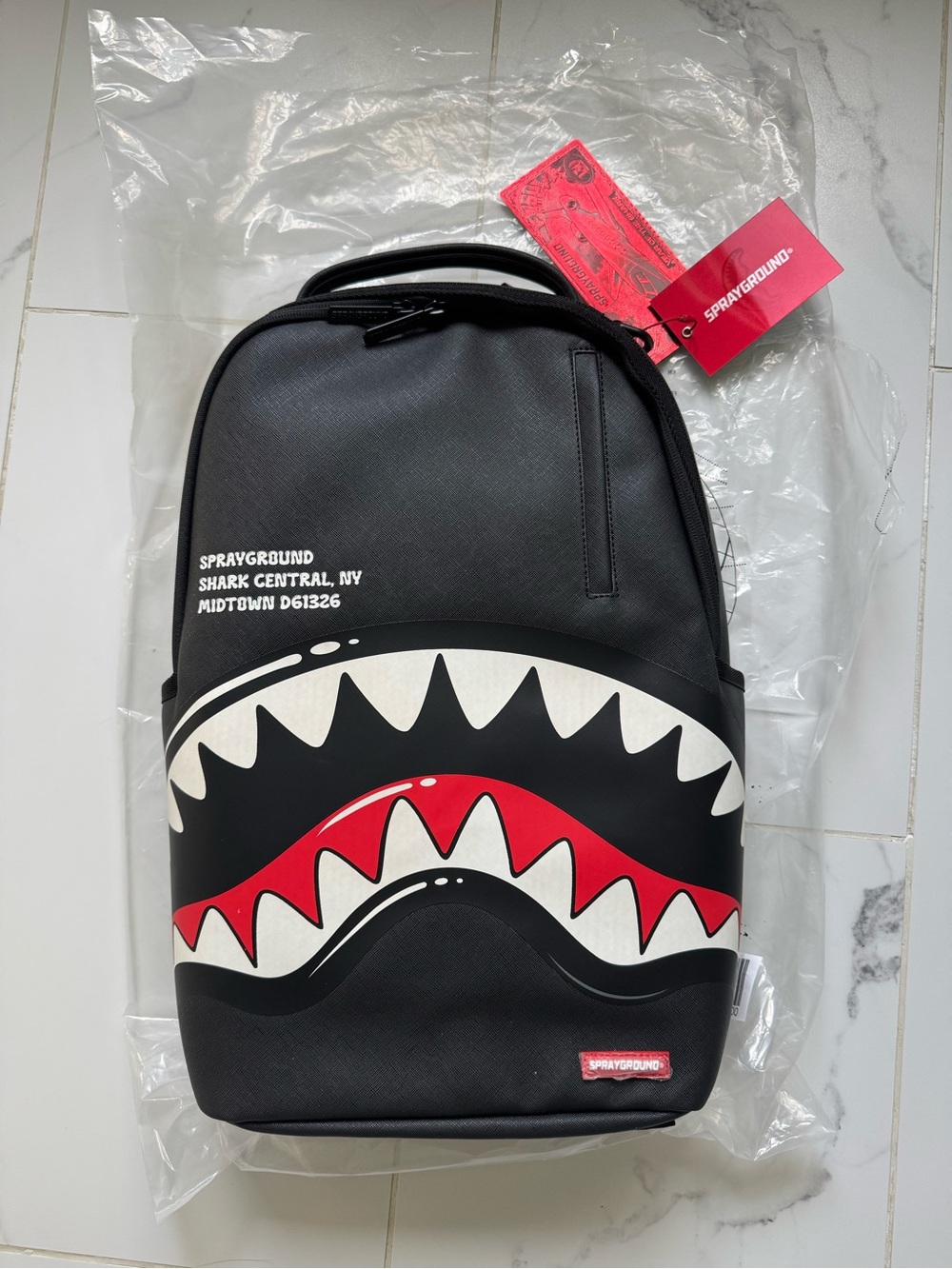 Sprayground Black Backpack with Red & White Shark Mouth Graphic